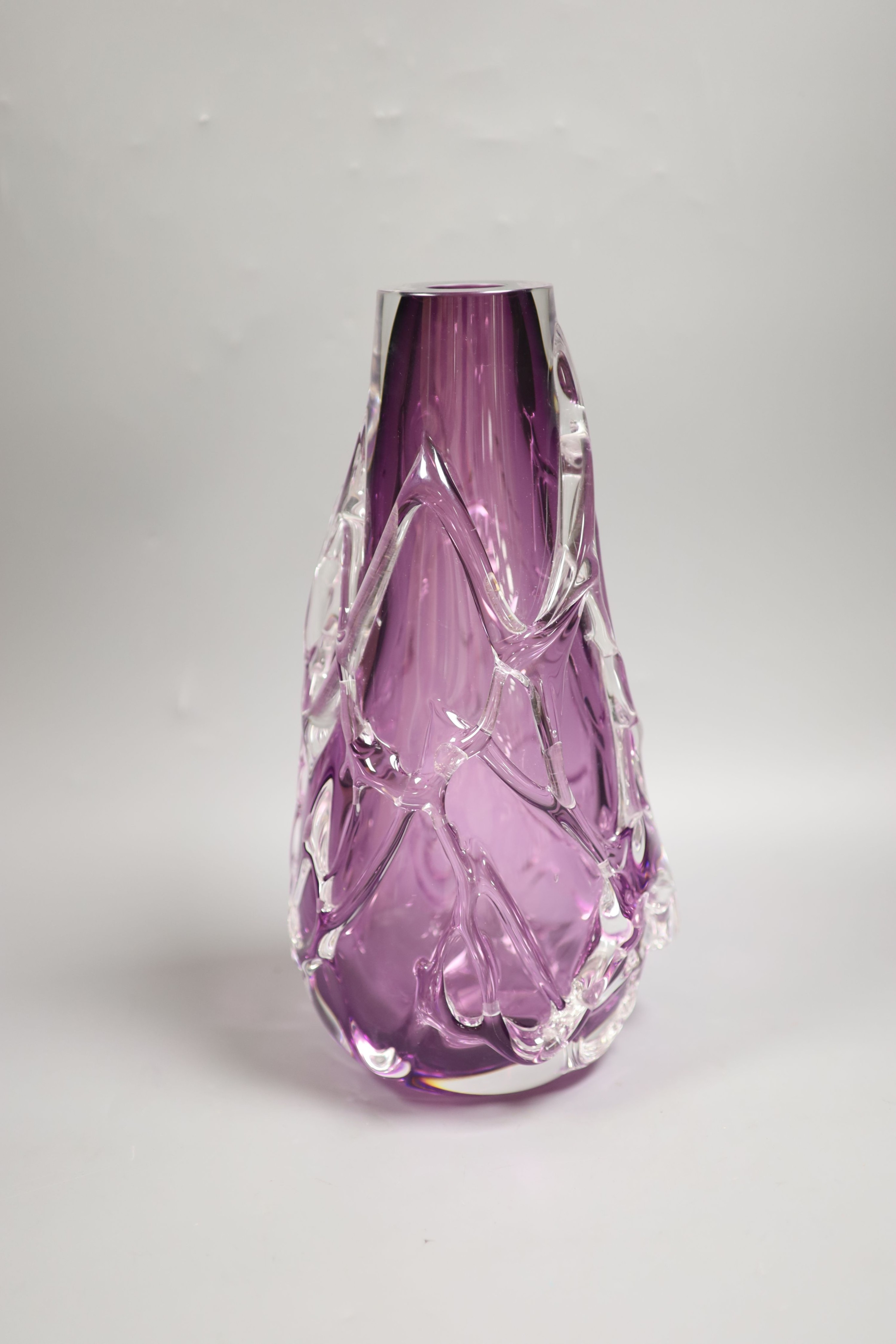 A large amethyst and clear cased glass vase